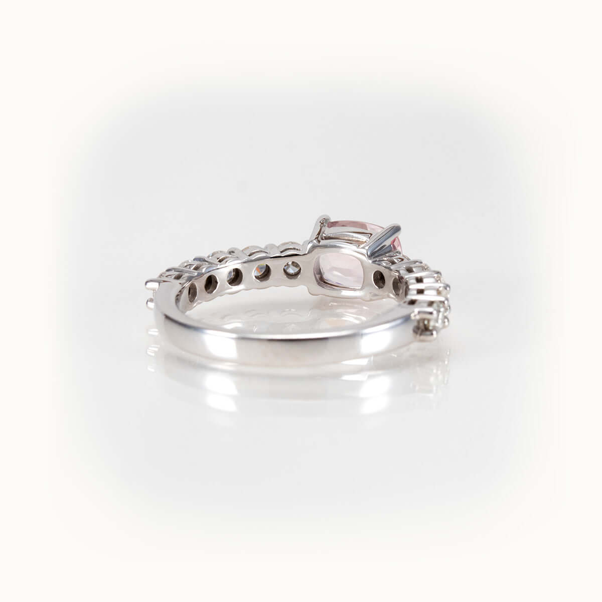 Elegant east-west morganite ring in 14kt white gold, featuring half-eternity diamond band for a sparkling finish.