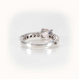 Elegant east-west morganite ring in 14kt white gold, featuring half-eternity diamond band for a sparkling finish.