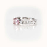 Elegant east-west pink morganite and diamond half-eternity ring in 14kt white gold.