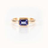 East West light purple tanzanite ring in 14kt yellow gold; elegant custom colored gemstone ring.