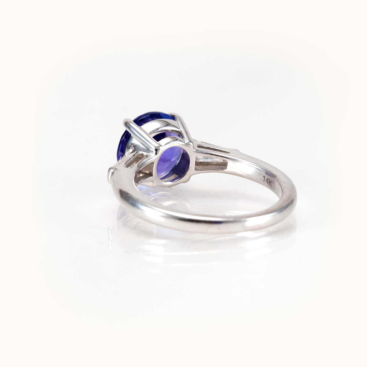 Tanzanite Elegance Ring in 14K white gold showcasing a vibrant 2.64-carat gemstone with tapered baguette side stones.