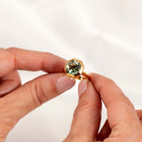 Bespoke octagon-cut prasiolite ring in 14K yellow gold, highlighting its unique gemstone and modern design.