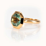 Octagon-cut bespoke prasiolite ring in 14K yellow gold featuring a minty green gemstone for elegant style.