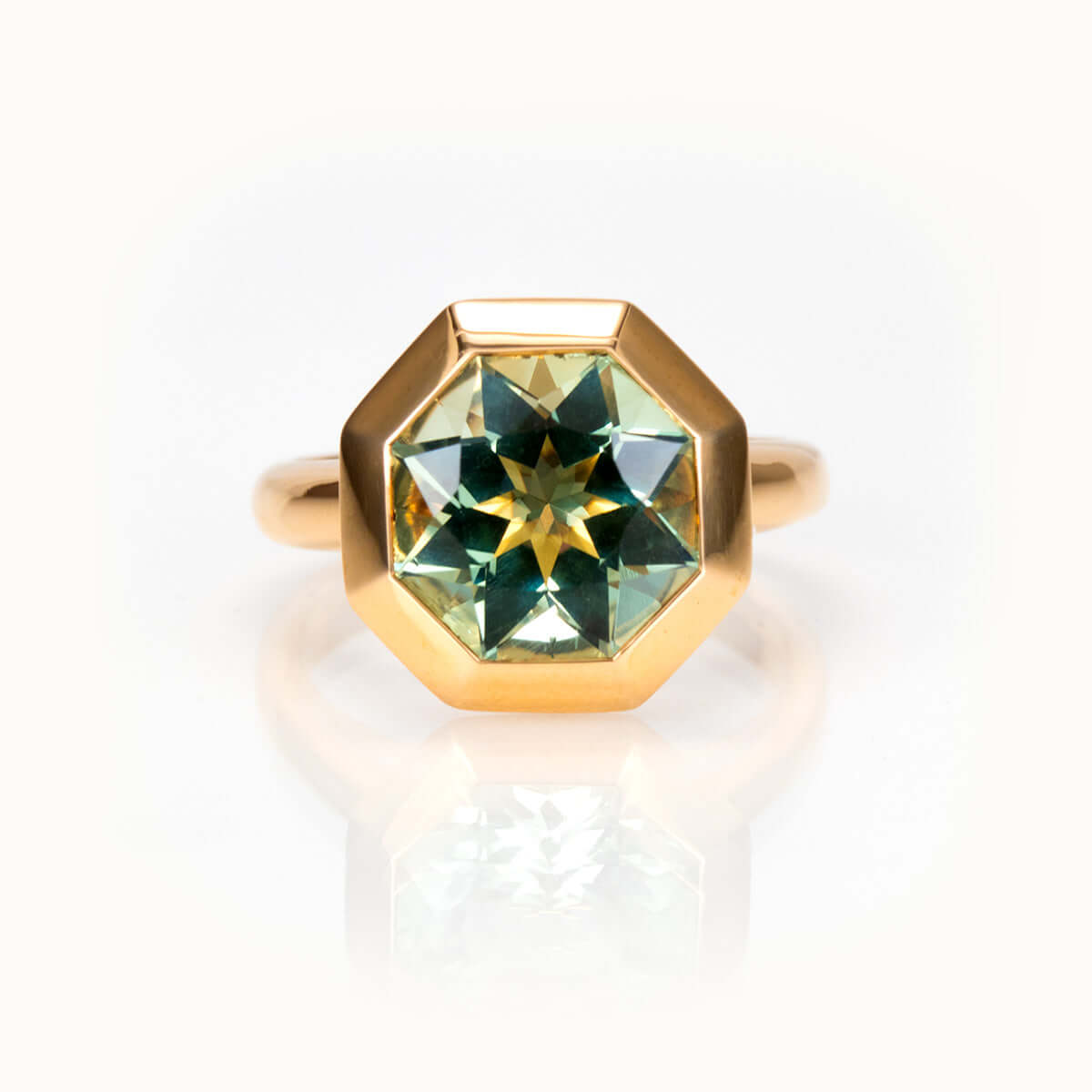Octagon-cut prasiolite ring in 14K yellow gold, bespoke custom gemstone jewelry.